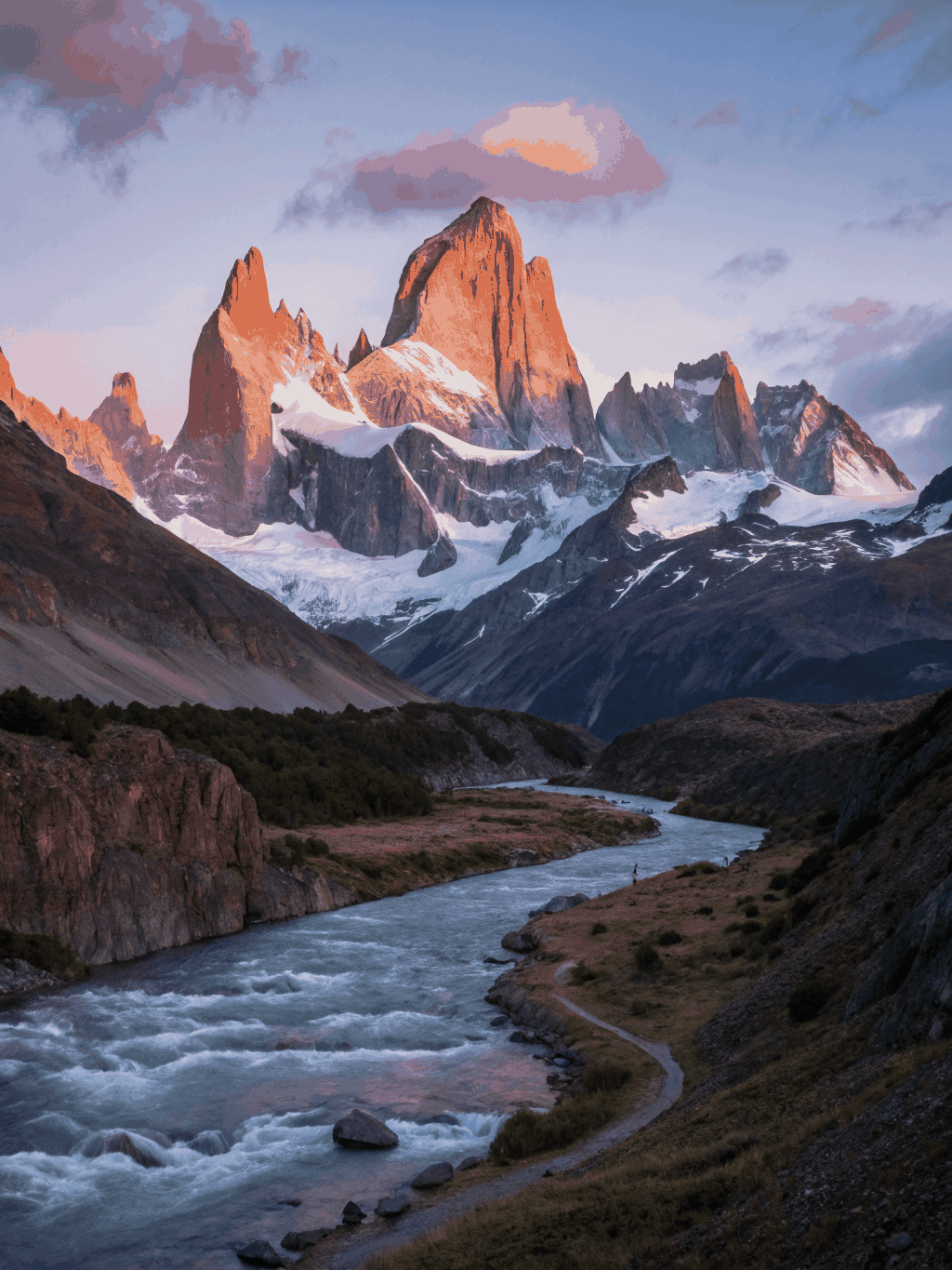 Mount Fitz Roy granite spires illuminated with dawn alpenglow in Patagonia